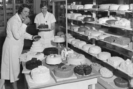 Judging cakes in the Women’s Building at the Fair is the judge, Mrs. Lloyd Cutler of Crown Point and her assistant Mrs. Lawrence Foster of Crawfordsville, superintendent of the Culinary Department in September 1931. Photo courtesy of Indiana Historical Society.