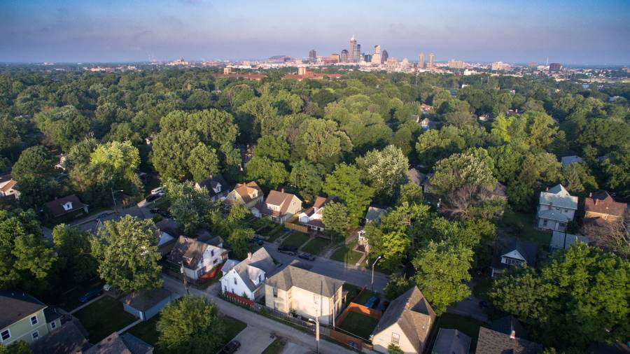 Indy neighborhoods drone view with city skyline in distance